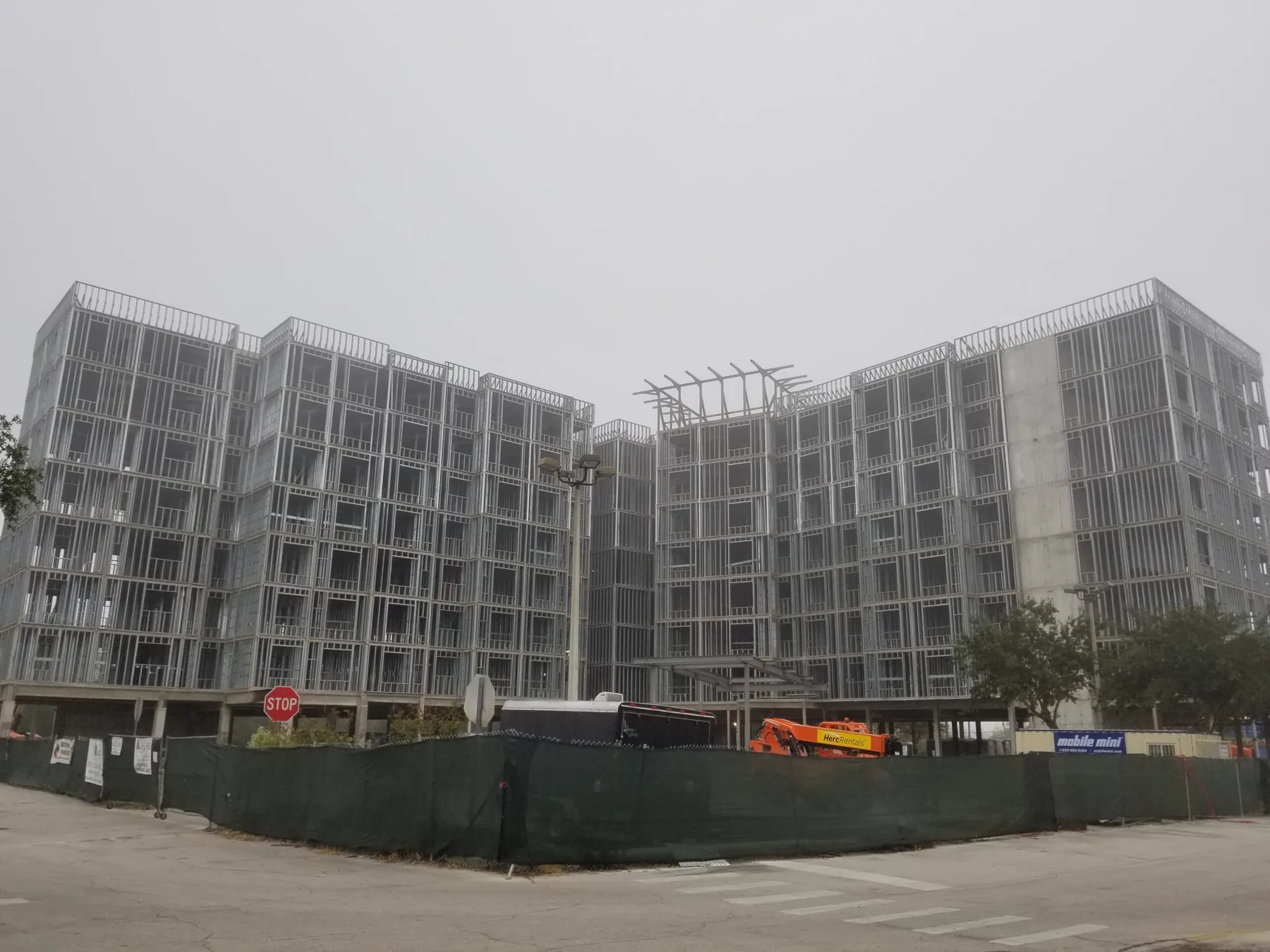 Hotel interior build-out with metal stud framing and overhead systems