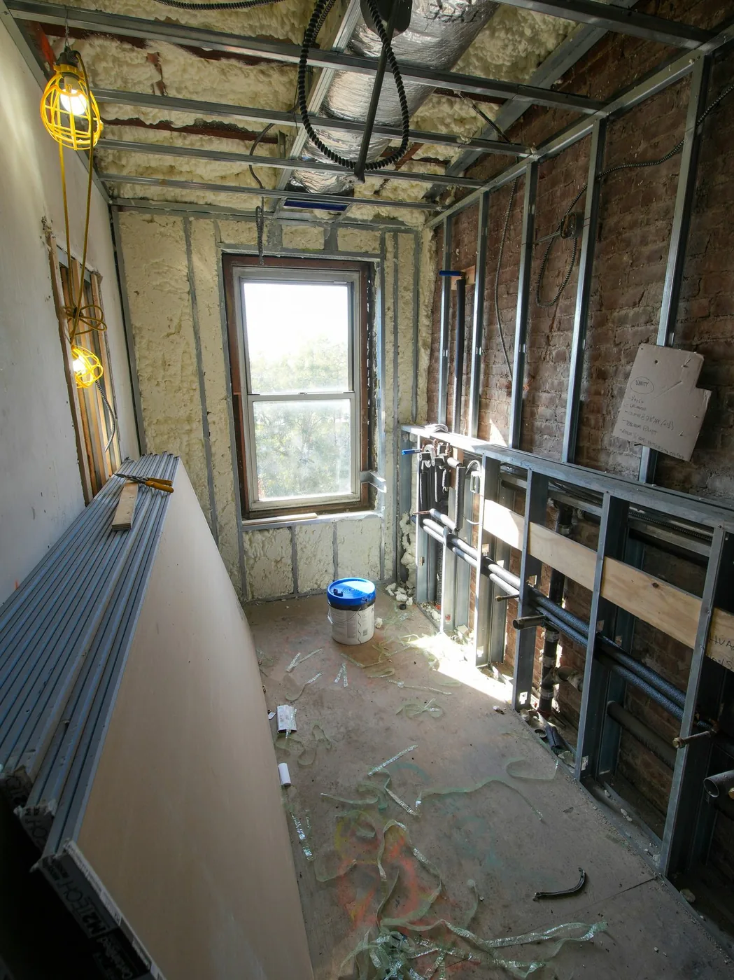 Apartment bathroom rough-in before finishes