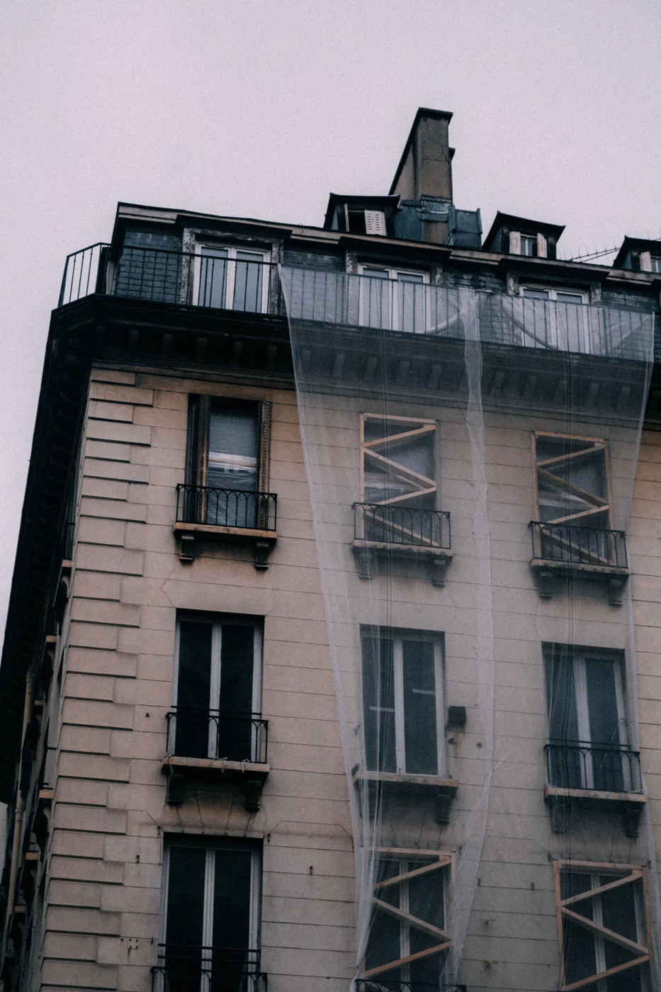 Multifamily exterior before and during rehabilitation