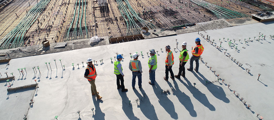 Seven workers at a construction site