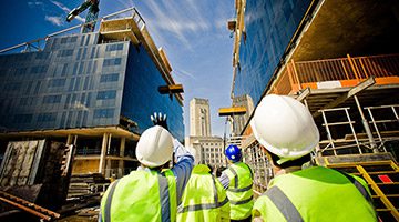 People with hardhats looking up