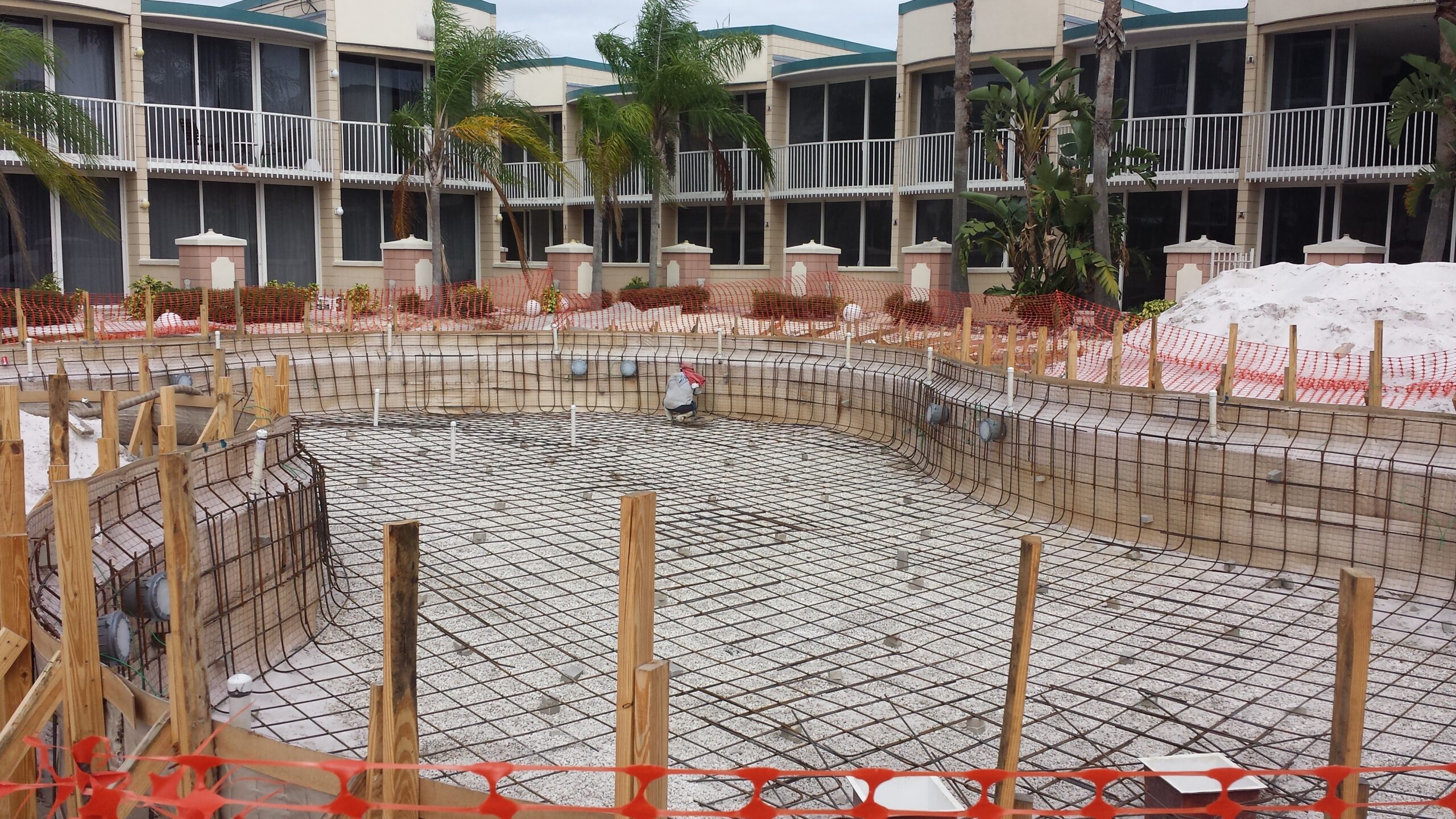 A huge pool being built with metal bars and cement