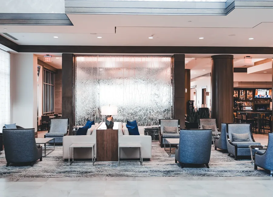 Contemporary hotel lounge with illuminated water wall