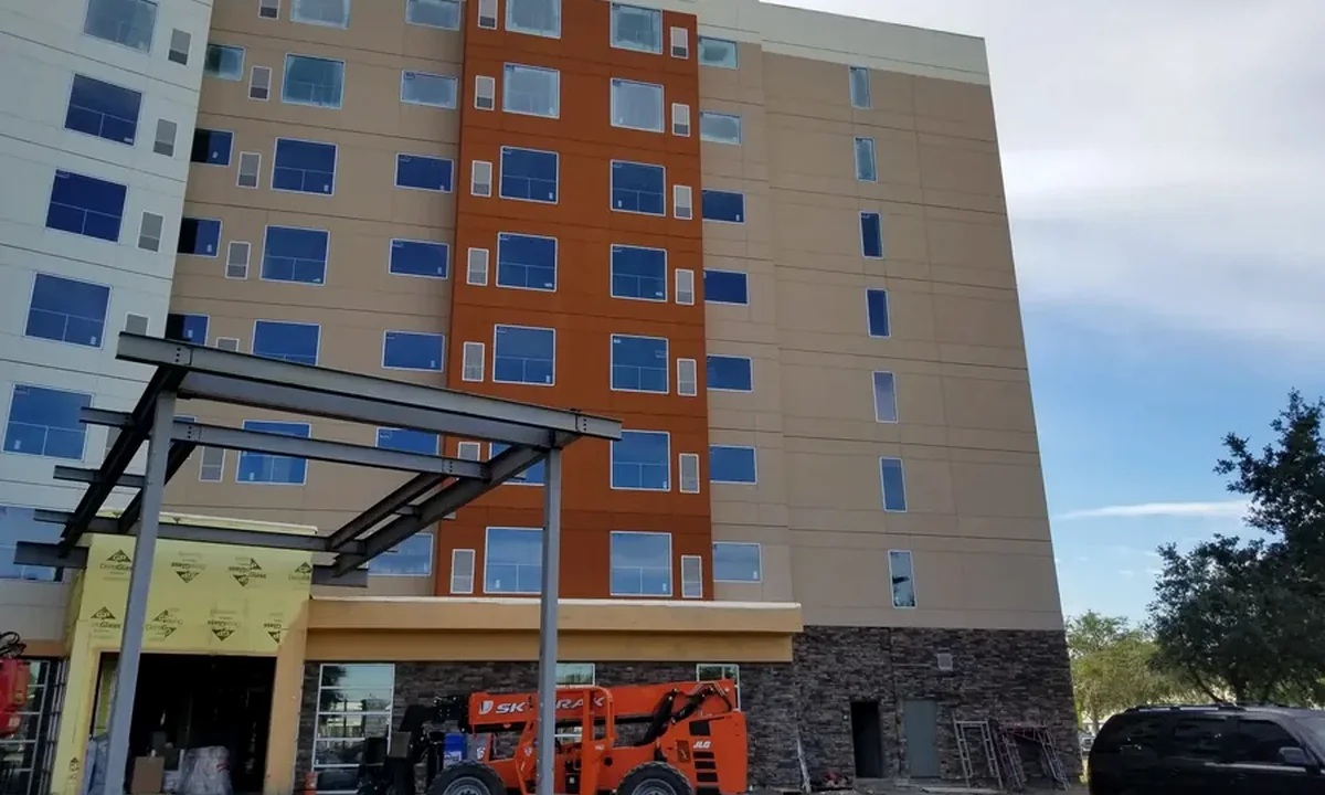 Multistory hotel exterior with steel canopy