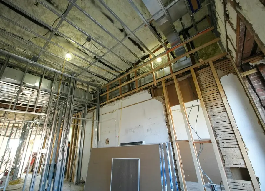 Interior room under renovation with exposed studs