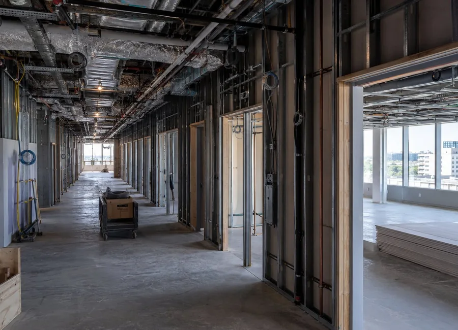Commercial shell corridor with exposed utilities