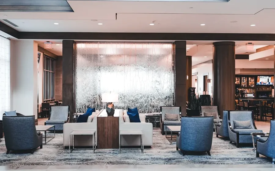 Modern hotel lobby with illuminated water wall