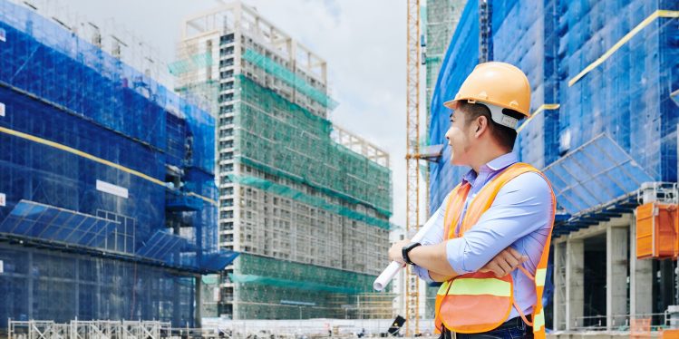 commercial building contractor looking at commercial construction building